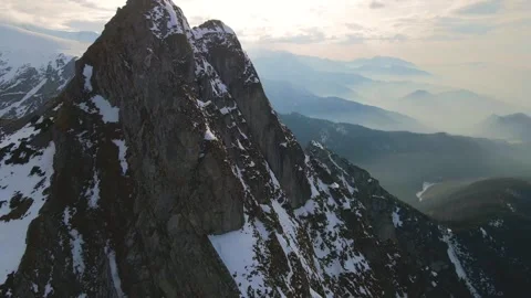 Mountain landscape and vast valleys. Cloudscape over snow-capped cliffs. Alas Stock Footage 331403382