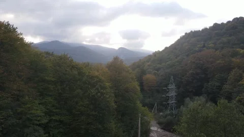 Mountain landscape with autumn forest and power lines Stock Footage 337889792