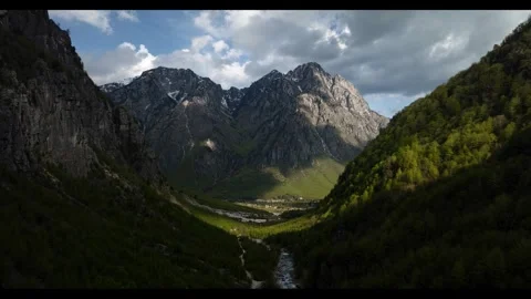 Mountain landscape bathed in the soft light of either dawn or dusk. Stock Footage 297869400