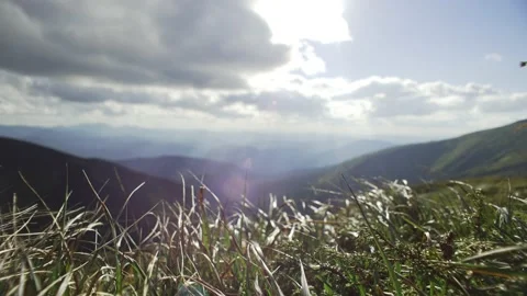 Mountain landscape, big clouds in sunny weather, light wind on top of mountain Stock Footage 218440821