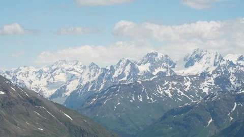 Mountain landscape with blue sky and floating clouds on a sunny day Stock Footage 342713961