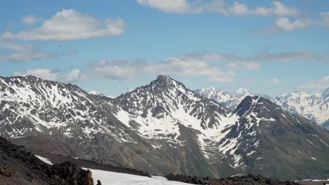 Mountain landscape with blue sky and floating clouds on a sunny day Stock Footage 342713966