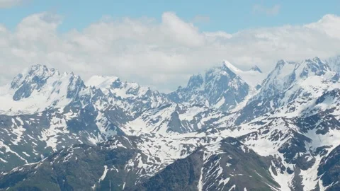 Mountain landscape with blue sky and floating clouds on a sunny day Stock Footage 342713969