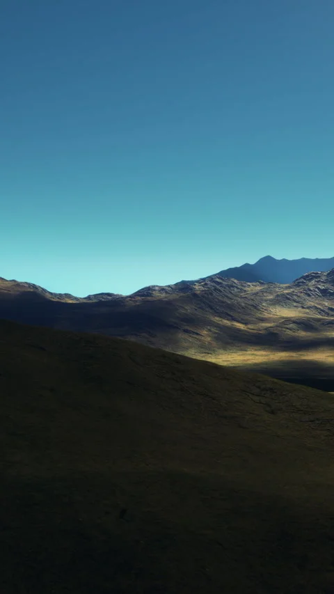Mountain landscape with clear sky and rolling hills during daytime Stock Footage 339043676