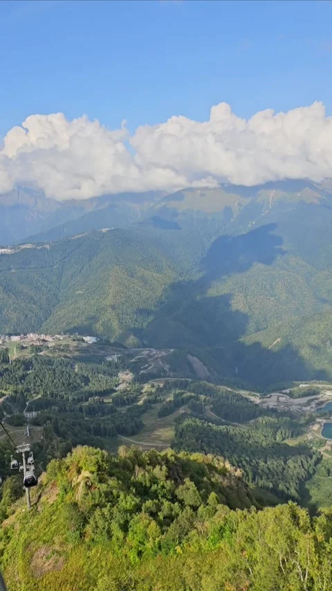 Mountain Landscape with Clouds and Forest Seen from Cable Lift Video stock 330586365