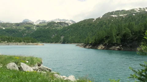 Mountain landscape with clouds and lake at Alpe Devero Stock Footage 64583762