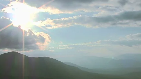  Mountain landscape  with clouds and sunbeams. Timelapse, PAL Stock Footage 79596147