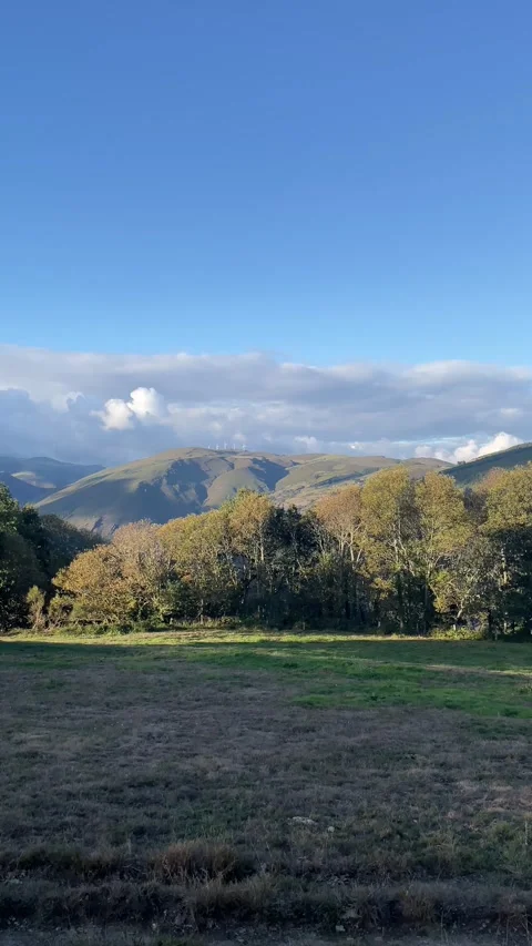 Mountain landscape with clouds and wind generators in the background. Vertical v Stock Footage 254064057