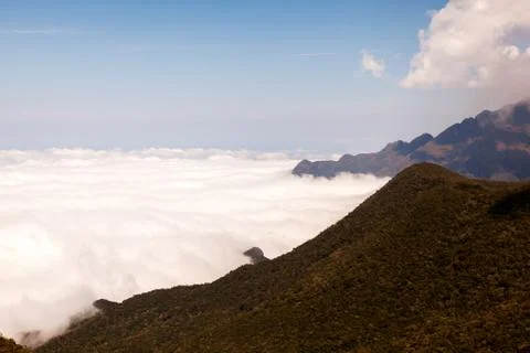 Mountain landscape with clouds below Stock Photos