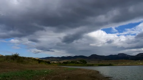 Mountain landscape. Clouds float across the blue sky. Stock Footage 141003714