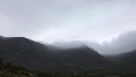 Mountain landscape. Clouds flowing through the mountains Stockbeeldmateriaal 93954167