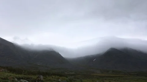 Mountain landscape. Clouds flowing through the mountains Stock Footage 93954239