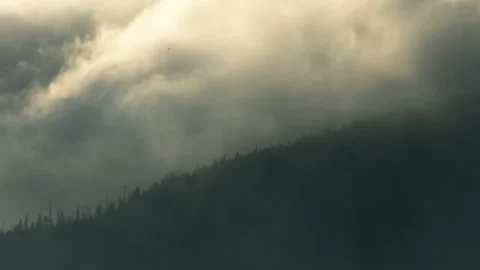 Mountain landscape with clouds illuminated by sunlight. Stock Footage 251862680