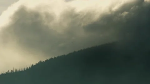 Mountain landscape with clouds illuminated by sunlight. Stock Footage 251863503