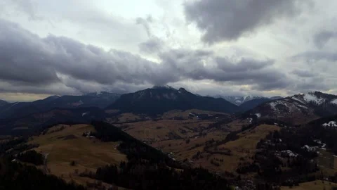 Mountain landscape in cloudy cloudy weather, Forests and pastures. End of winter Видео 264522326