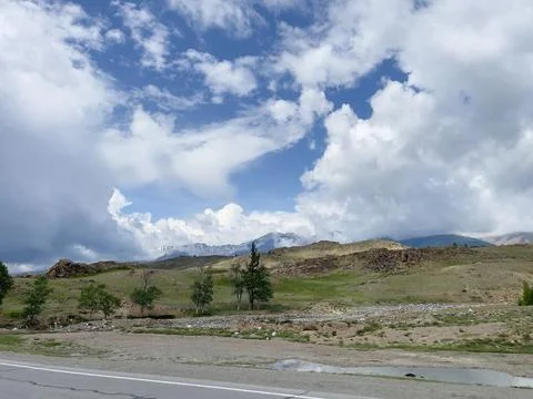 Mountain landscape with cloudy sky. Stock Photos