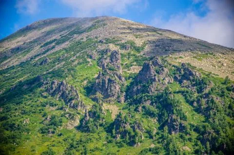Mountain landscape. deciduous forest. cloud on top. morning light Stock Photos