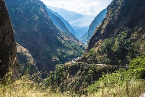 Mountain landscape with a deep gorge in the Himalayas. Stock Photos