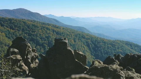 Mountain landscape. In the distance, ridges of mountains can be seen through Stock Footage 114706901