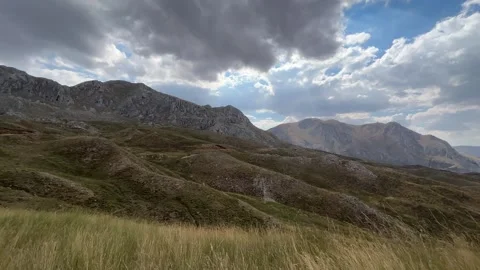 Mountain Landscape with Distant Sheep Herd and Alpine Pasture Stock Footage 343830803