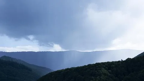 Mountain landscape with dramatic clouds Stock Photos