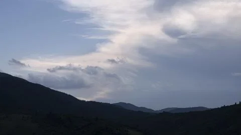 Mountain landscape with dramatic clouds Stock Photos