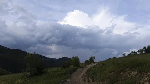 Mountain landscape with dramatic clouds Stock Photos