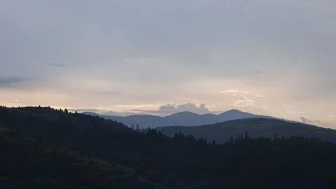 Mountain landscape with dramatic clouds Stock Photos