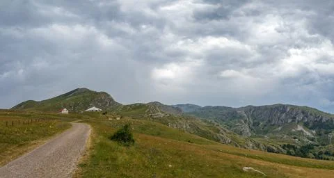 Mountain landscape with dramatic stormy clouds in sky Stock Photos