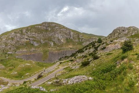 Mountain landscape with dramatic stormy clouds in sky Stock Photos