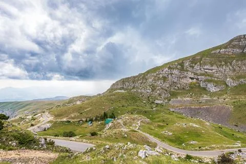 Mountain landscape with dramatic stormy clouds in sky Stock Photos