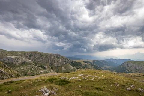 Mountain landscape with dramatic stormy clouds in sky Stock-Fotos