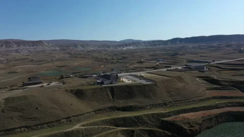Mountain landscape with dry fields and modern building Stock Footage 130629984