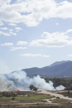 Mountain landscape with fire Stock Photos