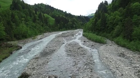Mountain landscape. Footage. River goes around the mountain. Top view Stock Footage