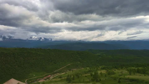 Mountain landscape with green grass and trees during the day Stock Footage 254435955