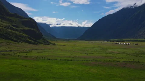 Mountain landscape with green grass during the day Stock Footage 248343211
