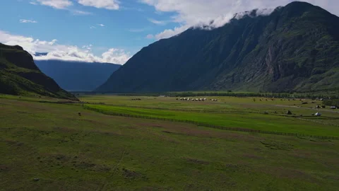 Mountain landscape with green grass during the day Stock Footage 248343289