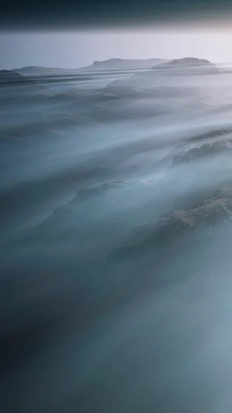 Mountain landscape with light flowing through clouds in the distance Stock Footage 345010128