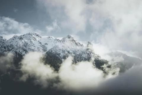 Mountain landscape with low clouds - winter mood Stock Photos