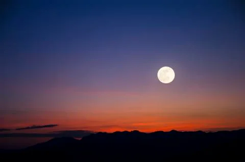 Mountain landscape with the moon Stock Photos
