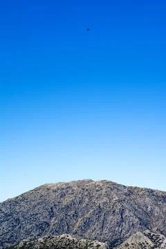 Mountain landscape with mountains and eagle in the distance Stock Photos