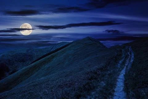 Mountain landscape. path through hill side to the mountain top at night Stock-Fotos