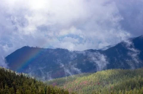 Mountain landscape with a rainbow Stock Photos