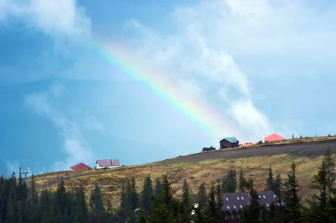 Mountain landscape with a rainbow Stock Photos