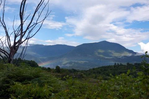 Mountain landscape with rainbow Stock Photos