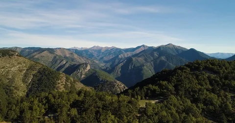 Mountain landscape revealed from behind forest on mountain drone aerial 4k Stock Footage 125754458