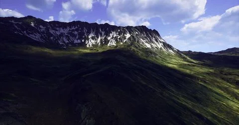 Mountain landscape reveals dramatic textures and colors during daylight hours Illustrazione stock