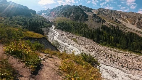 Mountain landscape with a river and a trail 스톡 동영상 317687683