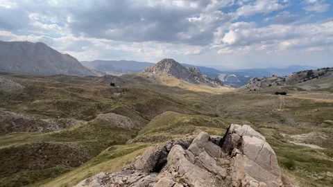 Mountain Landscape with Rock Foreground and Quiet Alpine Atmosphere Stock Footage 343830688